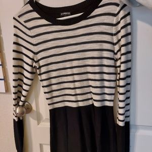 Black and white striped long sleeve sweater dress. Mid-length. Fitted.